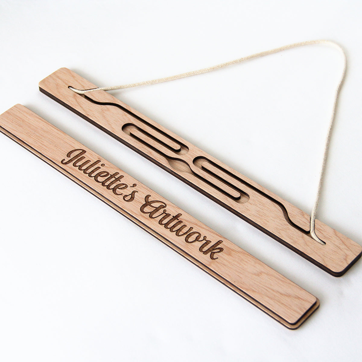wooden artwork hanger separated on a white background