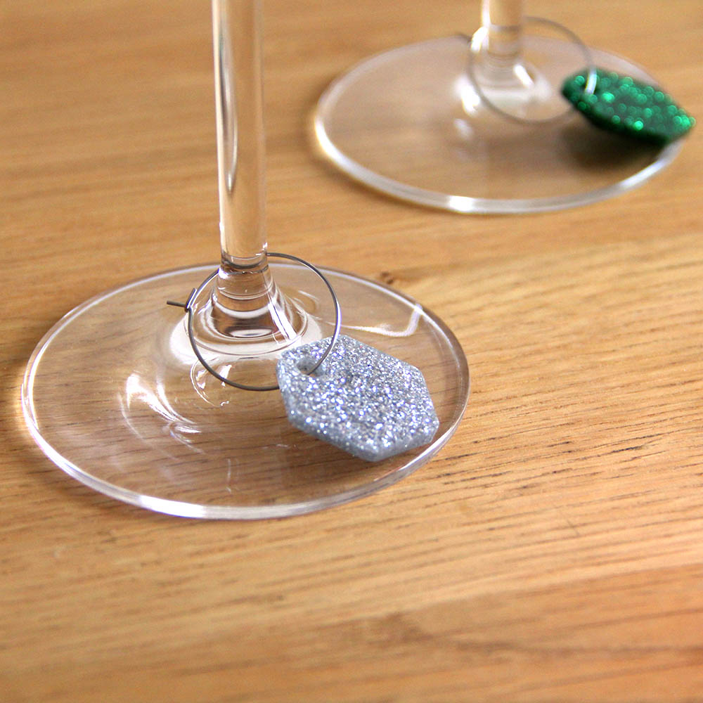 silver and green glitter wine charms