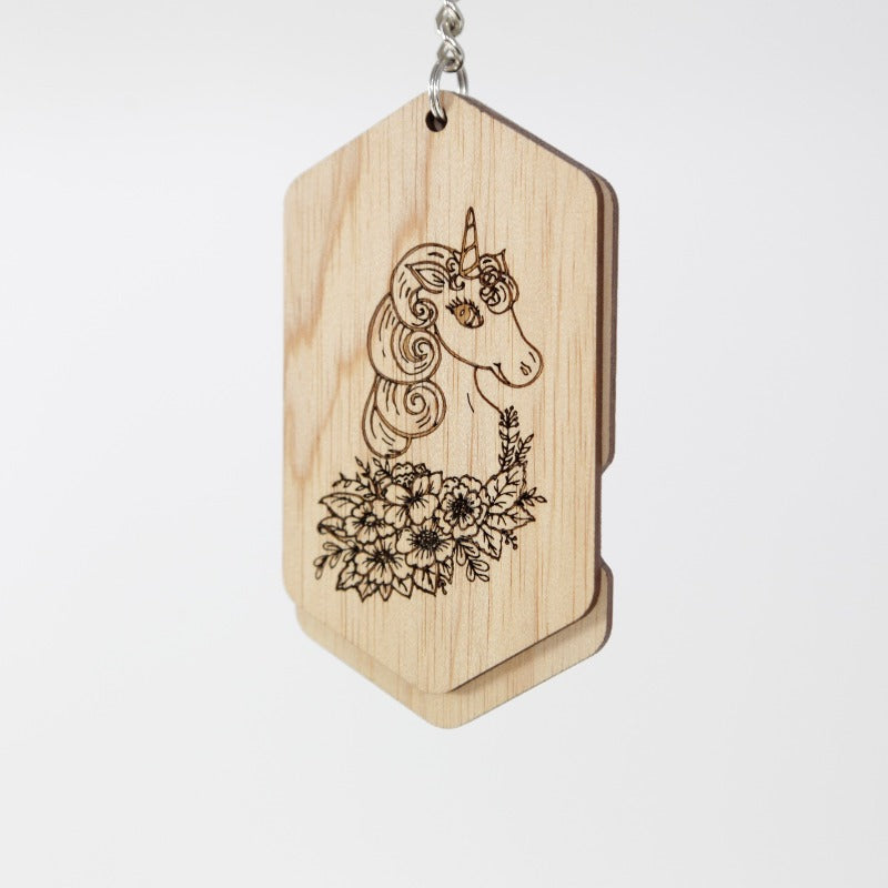wooden bag id tag with a unicorn etched on the front